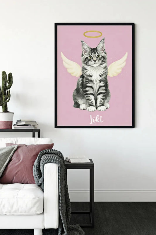 Framed artwork of a cat with wings and a halo on a pink background, displayed in a living room.