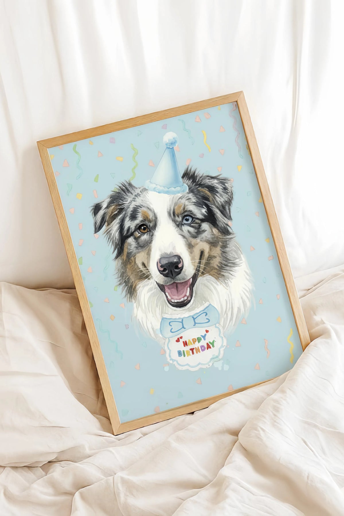 Framed artwork of a dog wearing a birthday hat with 'Happy Birthday' text on a light blue background.