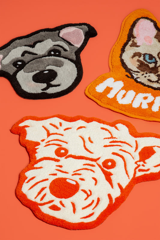 Three dog-themed patches on an orange background