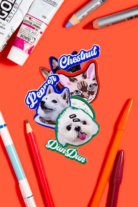 Stickers of dogs with names on an orange background with art supplies.