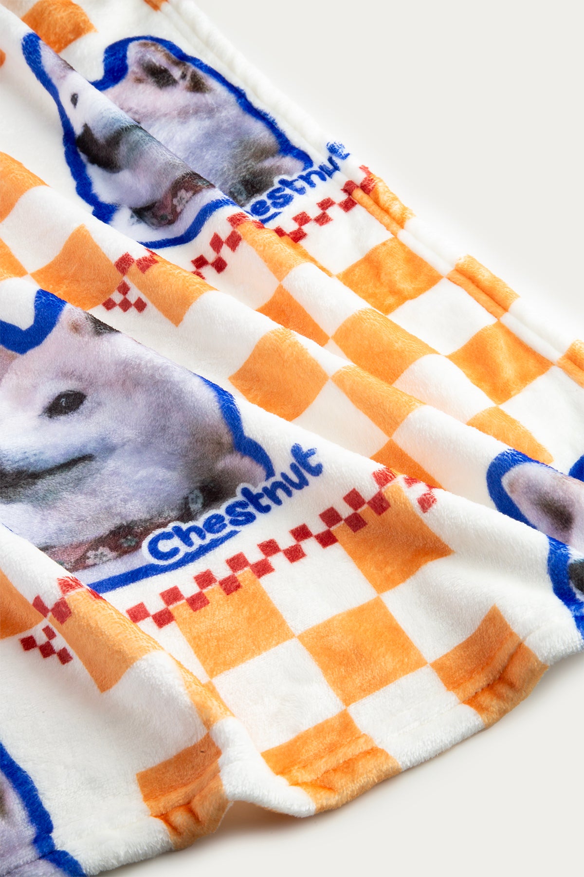 Checkered fabric with dog images and 'Chestnut' branding on a white background