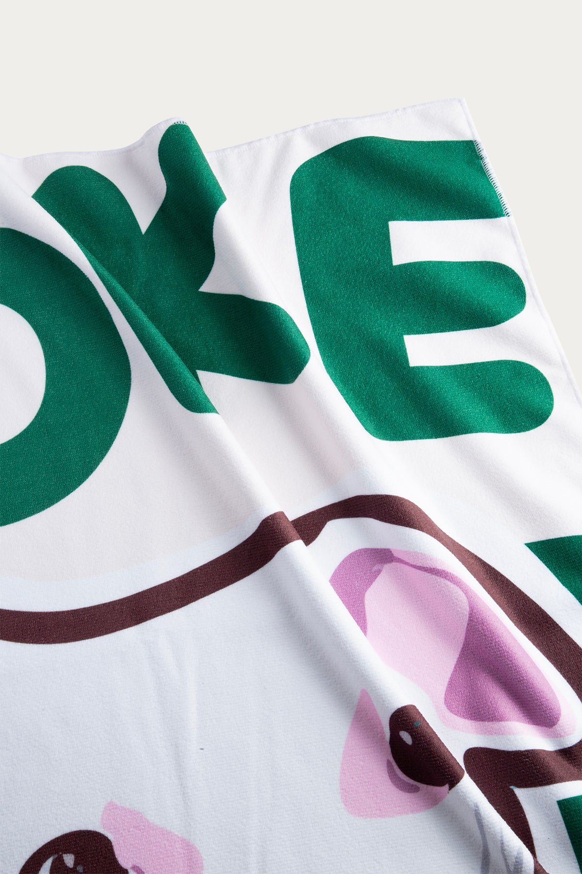 Close-up of a product with green and white text on a white background