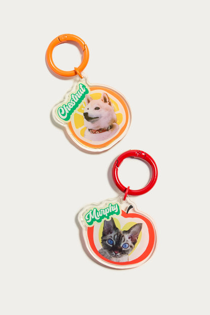 Two pet name tags with dog and cat illustrations on a white background