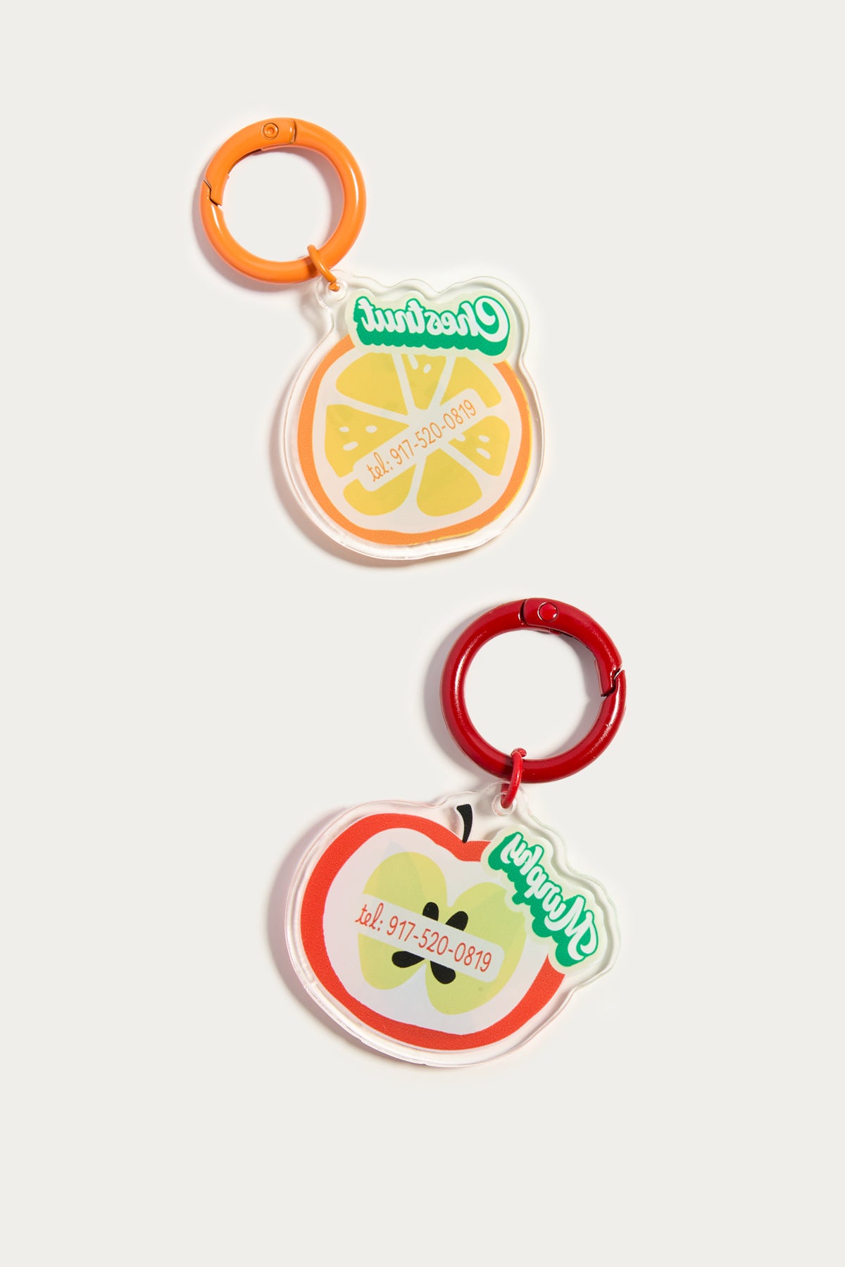 Two fruit-themed baby teether toys on a white background