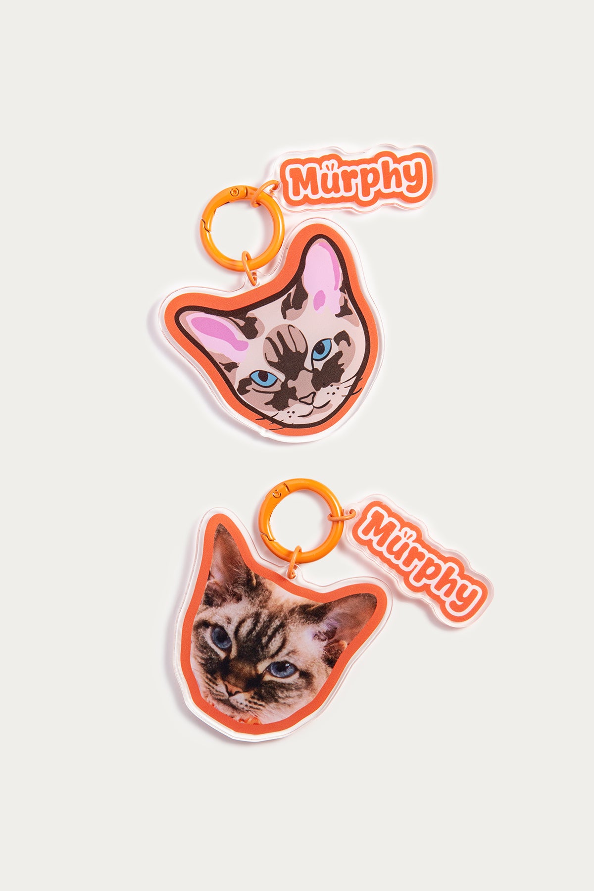 Two cat-themed keychains with 'Murphy' branding on a white background