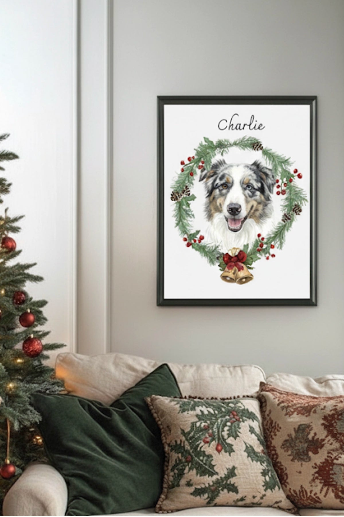 Framed artwork of a dog named Charlie with a wreath on a wall above a decorated Christmas tree and sofa.