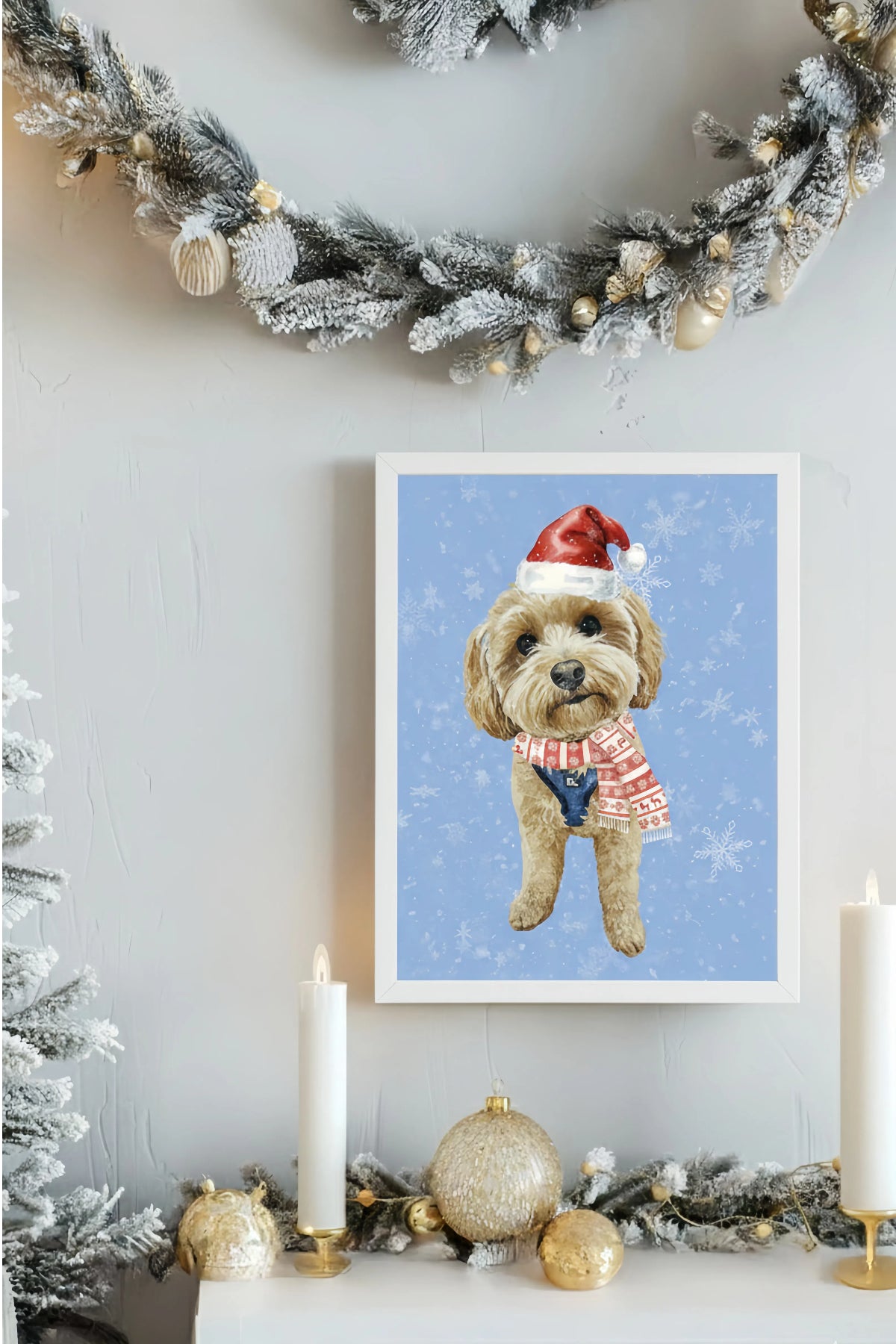 Framed artwork of a dog wearing a Santa hat on a wall decorated with Christmas garlands and lights.